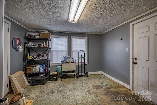 office space with a textured ceiling, baseboards, and crown molding