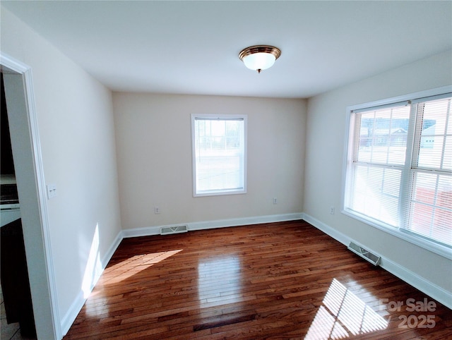 1806 Bringle Ferry Rd, Salisbury, NC 28146 - spare room featuring dark wood-style floors, visible vents, and baseboards