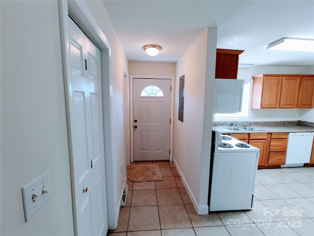 1806 Bringle Ferry Rd, Salisbury, NC 28146 - kitchen with white appliances, light tile patterned floors, baseboards, light countertops, and a sink