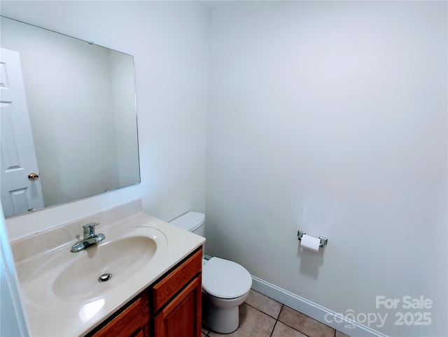 1806 Bringle Ferry Rd, Salisbury, NC 28146 - bathroom featuring toilet, tile patterned flooring, baseboards, and vanity
