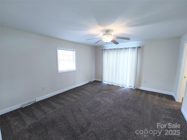 1806 Bringle Ferry Rd, Salisbury, NC 28146 - spare room featuring a ceiling fan, dark colored carpet, visible vents, and baseboards