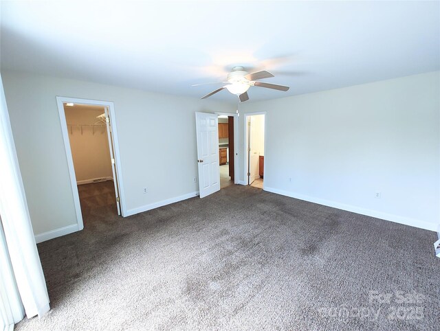 1806 Bringle Ferry Rd, Salisbury, NC 28146 - unfurnished bedroom with a spacious closet, a closet, dark colored carpet, and baseboards