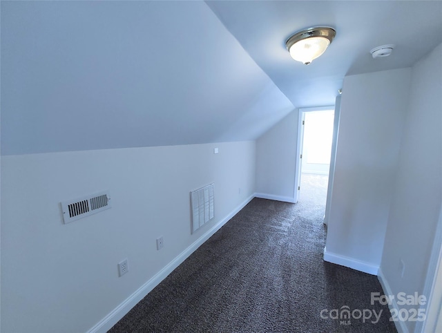 1806 Bringle Ferry Rd, Salisbury, NC 28146 - additional living space with baseboards, vaulted ceiling, visible vents, and dark colored carpet