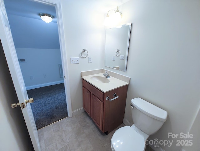 1806 Bringle Ferry Rd, Salisbury, NC 28146 - half bath with visible vents, baseboards, toilet, lofted ceiling, and vanity