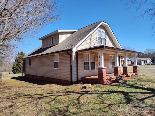 1806 Bringle Ferry Rd, Salisbury, NC 28146 - view of side of property featuring roof with shingles, a porch, and a yard