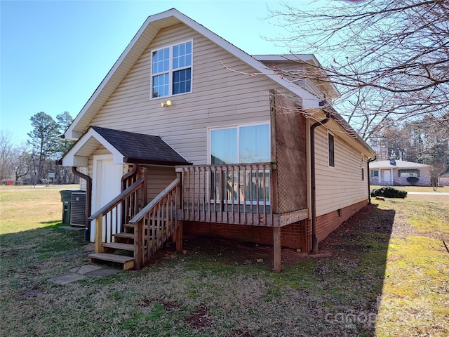 1806 Bringle Ferry Rd, Salisbury, NC 28146 - rear view of house featuring a deck, roof with shingles, stairway, and a lawn
