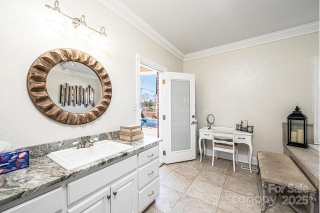 bathroom featuring ornamental molding and vanity