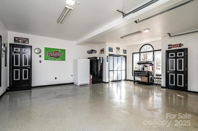 garage featuring baseboards