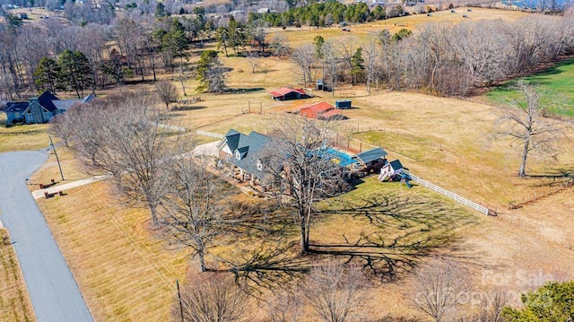 birds eye view of property with a rural view