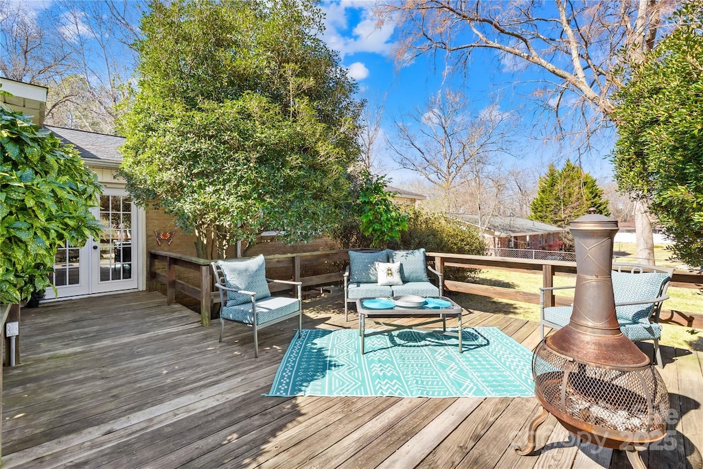 wooden deck featuring french doors