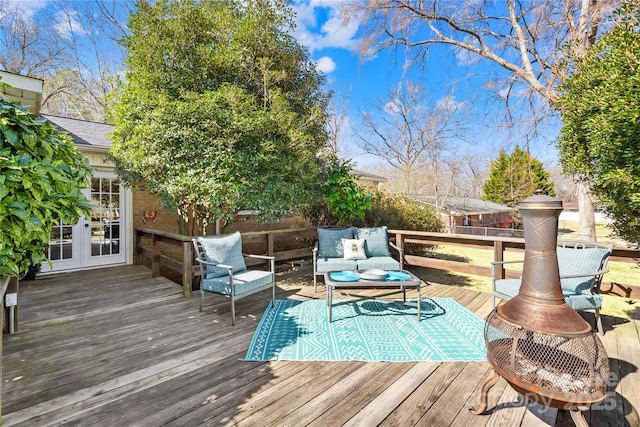 wooden deck featuring french doors