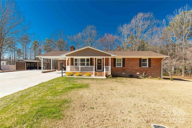 single story home with driveway, brick siding, crawl space, covered porch, and a front yard