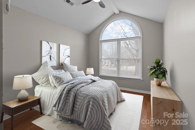 bedroom featuring vaulted ceiling with beams, visible vents, ceiling fan, wood finished floors, and baseboards