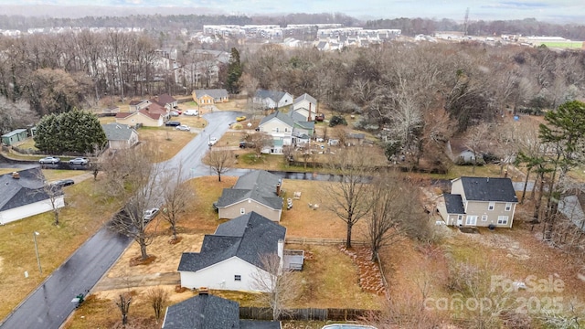 birds eye view of property with a residential view