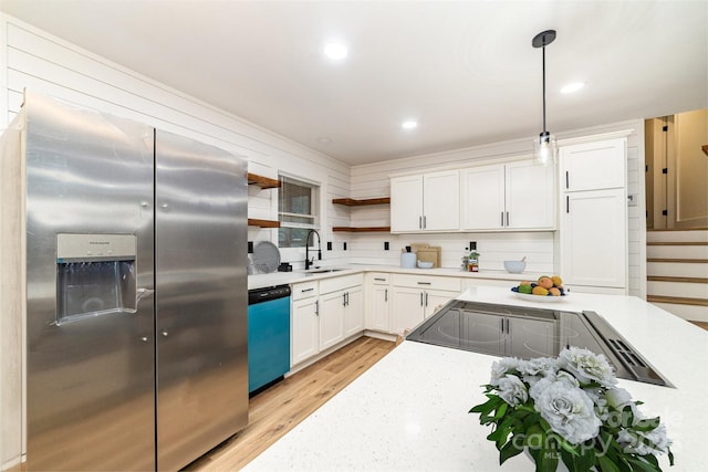 kitchen with stainless steel fridge, dishwashing machine, white cabinetry, open shelves, and a sink