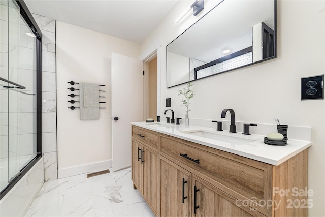 full bath with marble finish floor, double vanity, a sink, and visible vents