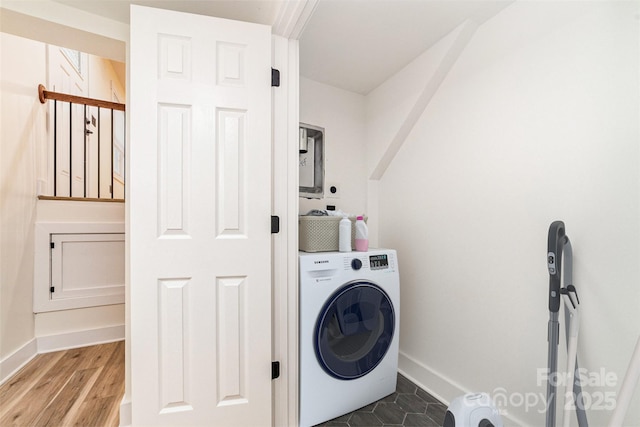 laundry room with washer / dryer, laundry area, baseboards, and wood finished floors