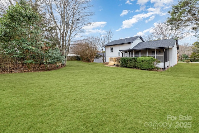 view of yard with a sunroom