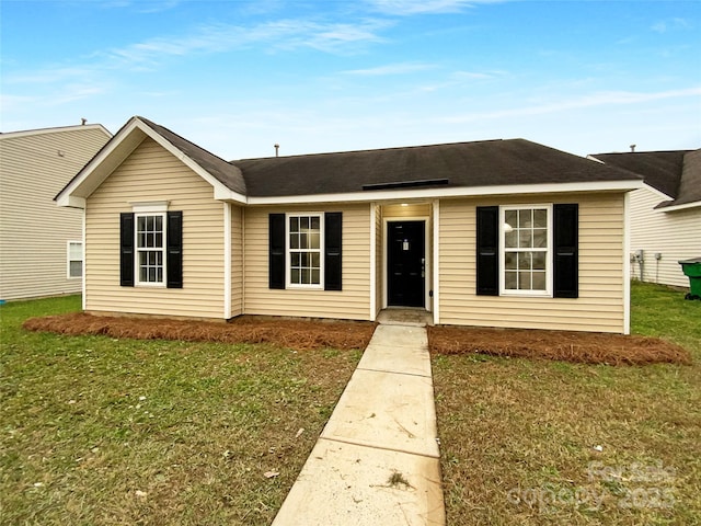 ranch-style house with a front lawn