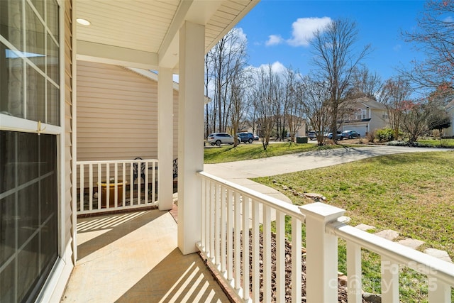 balcony featuring a porch and a residential view