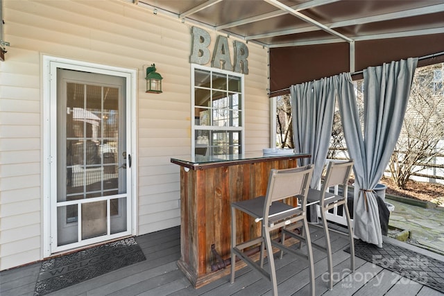 wooden deck featuring outdoor dry bar