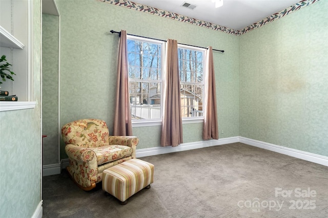 sitting room with carpet floors, visible vents, baseboards, and wallpapered walls