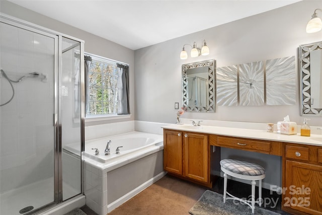 full bathroom featuring a stall shower, a garden tub, and vanity