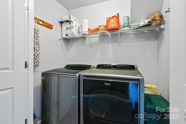 laundry room featuring washing machine and dryer and laundry area