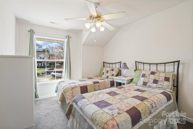 bedroom featuring ceiling fan, lofted ceiling, light colored carpet, visible vents, and baseboards