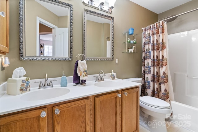 full bathroom with a sink, shower / bathtub combination with curtain, toilet, and double vanity