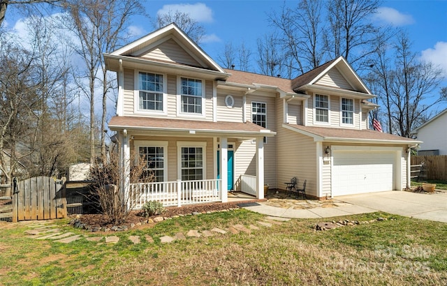 view of front of property featuring a porch, driveway, a front lawn, and fence