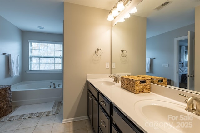 ensuite bathroom with a bath, visible vents, a sink, and ensuite bathroom