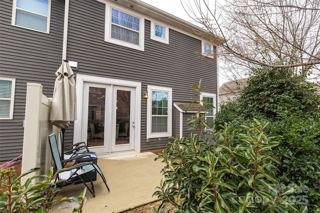 back of house with french doors and a patio