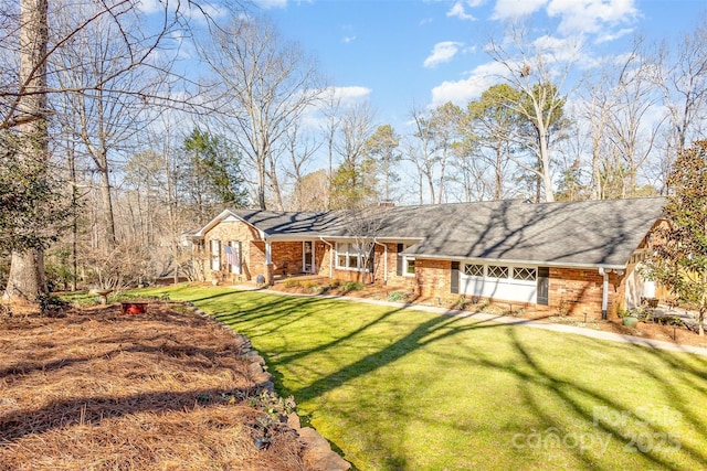 view of front of home with brick siding and a front lawn