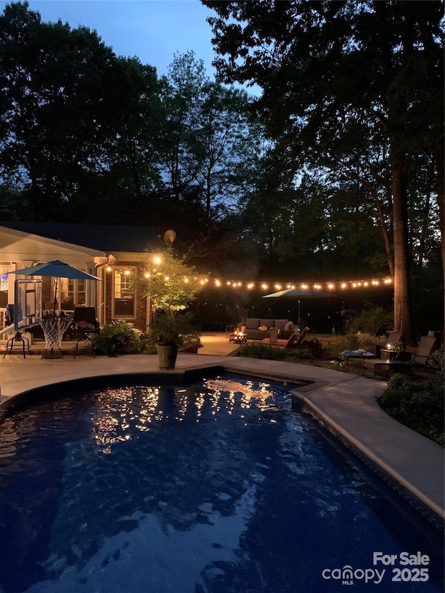 pool with a patio area