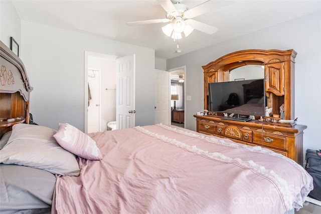 bedroom with a ceiling fan and ensuite bath