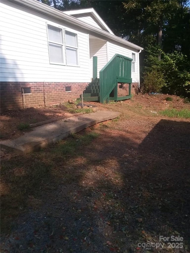 view of property exterior featuring crawl space