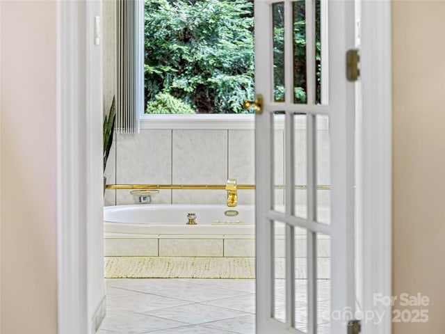 bathroom with a garden tub