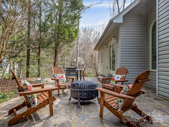 view of patio / terrace with a fire pit