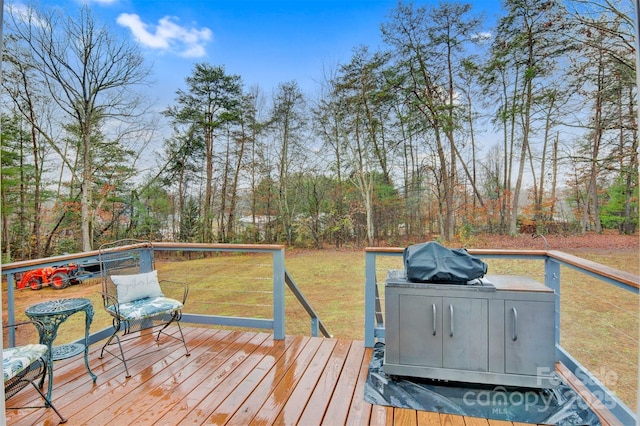 wooden terrace with a yard