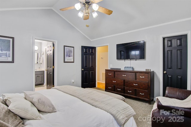 bedroom featuring lofted ceiling, light colored carpet, ceiling fan, and ensuite bath