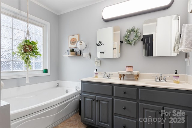 full bathroom with double vanity, ornamental molding, a sink, a bath, and tile patterned floors