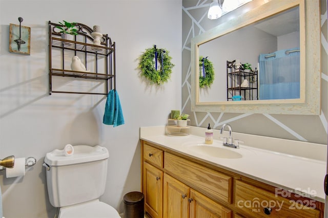 full bath with vanity and toilet