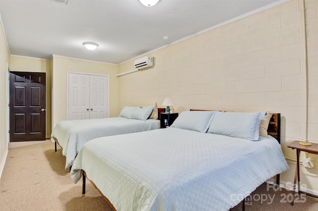 bedroom with light carpet, baseboards, a wall mounted AC, a closet, and crown molding