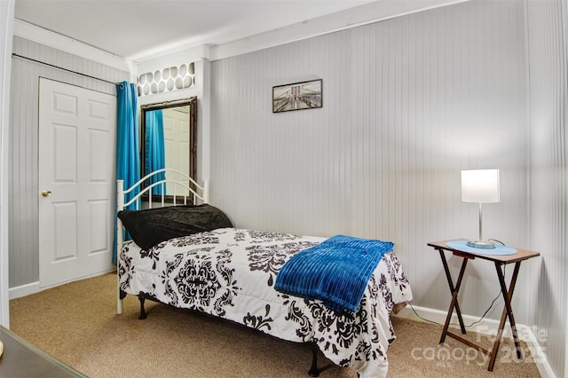 bedroom featuring carpet floors and baseboards