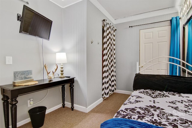 carpeted bedroom featuring ornamental molding and baseboards