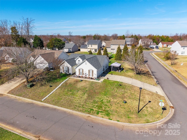 birds eye view of property with a residential view