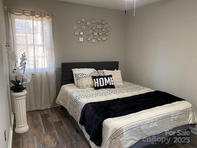 bedroom with wood finished floors