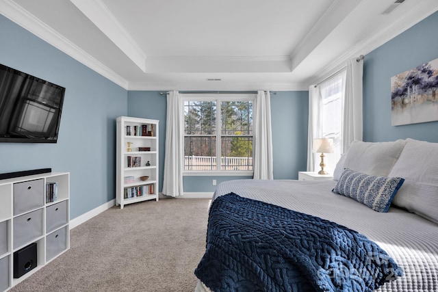 bedroom featuring carpet floors, a raised ceiling, visible vents, ornamental molding, and baseboards