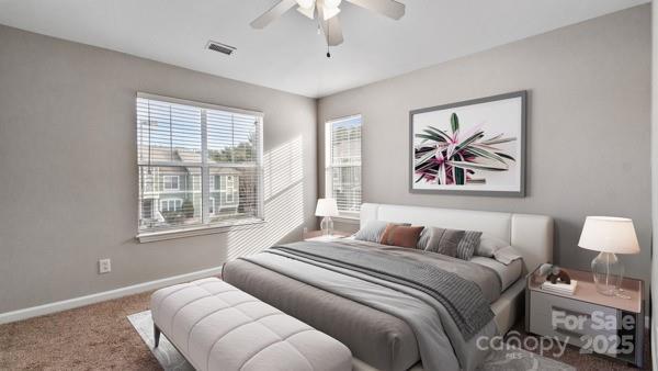 bedroom featuring carpet, visible vents, baseboards, and ceiling fan